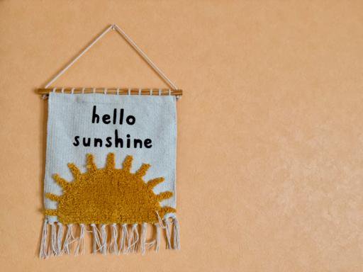 A woven wall tapestry showing the words